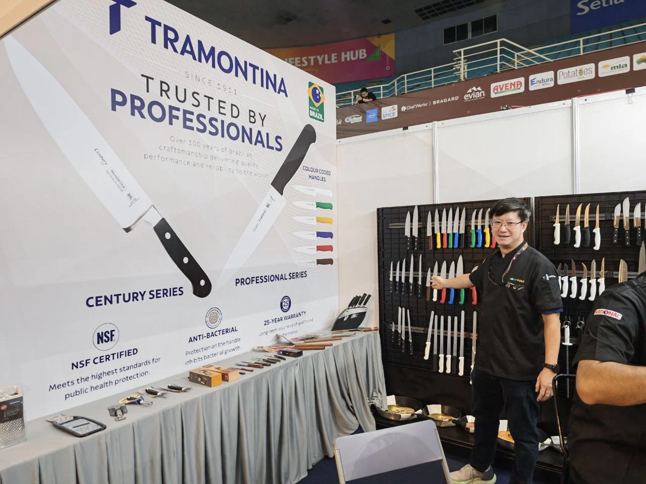 Professional knives on display at a supplier stand during the event.