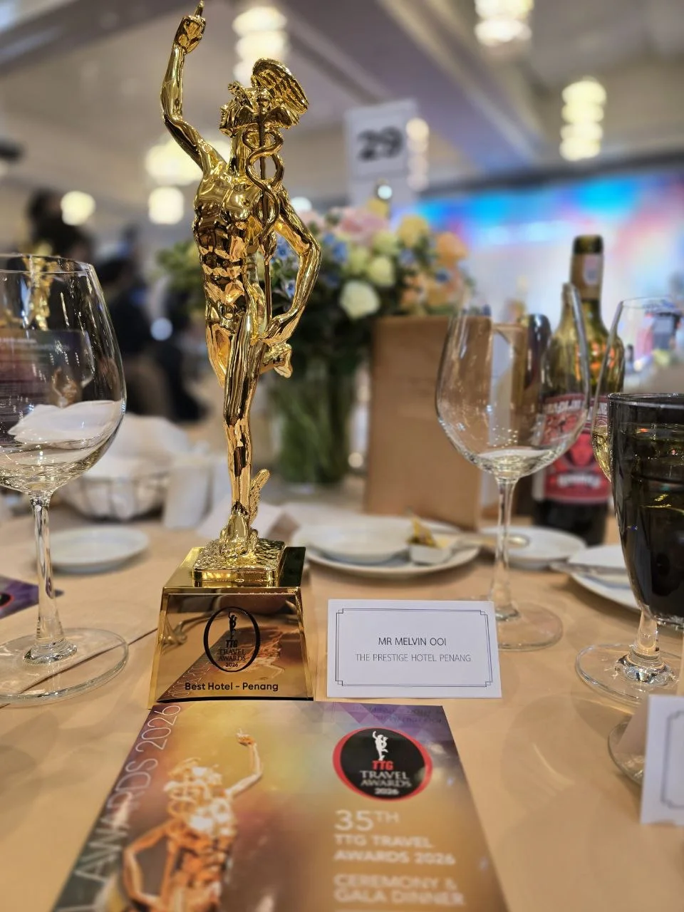 The Best Hotel in Penang trophy and place card for Melvin Ooi at the 35th Annual TTG Travel Awards gala dinner