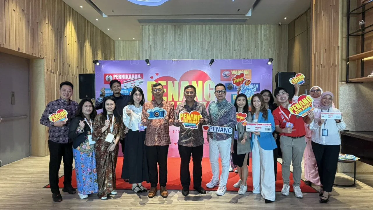 Delegates and industry players pose with campaign props at the Penang Beda Banget roadshow in Batam