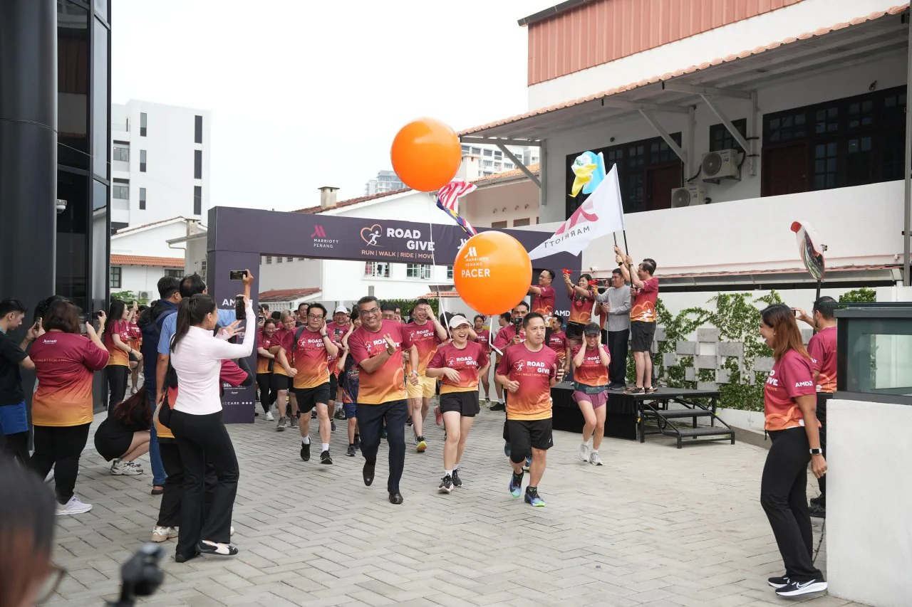 Runners setting off from the start arch at the Penang Region Road to Give 2026