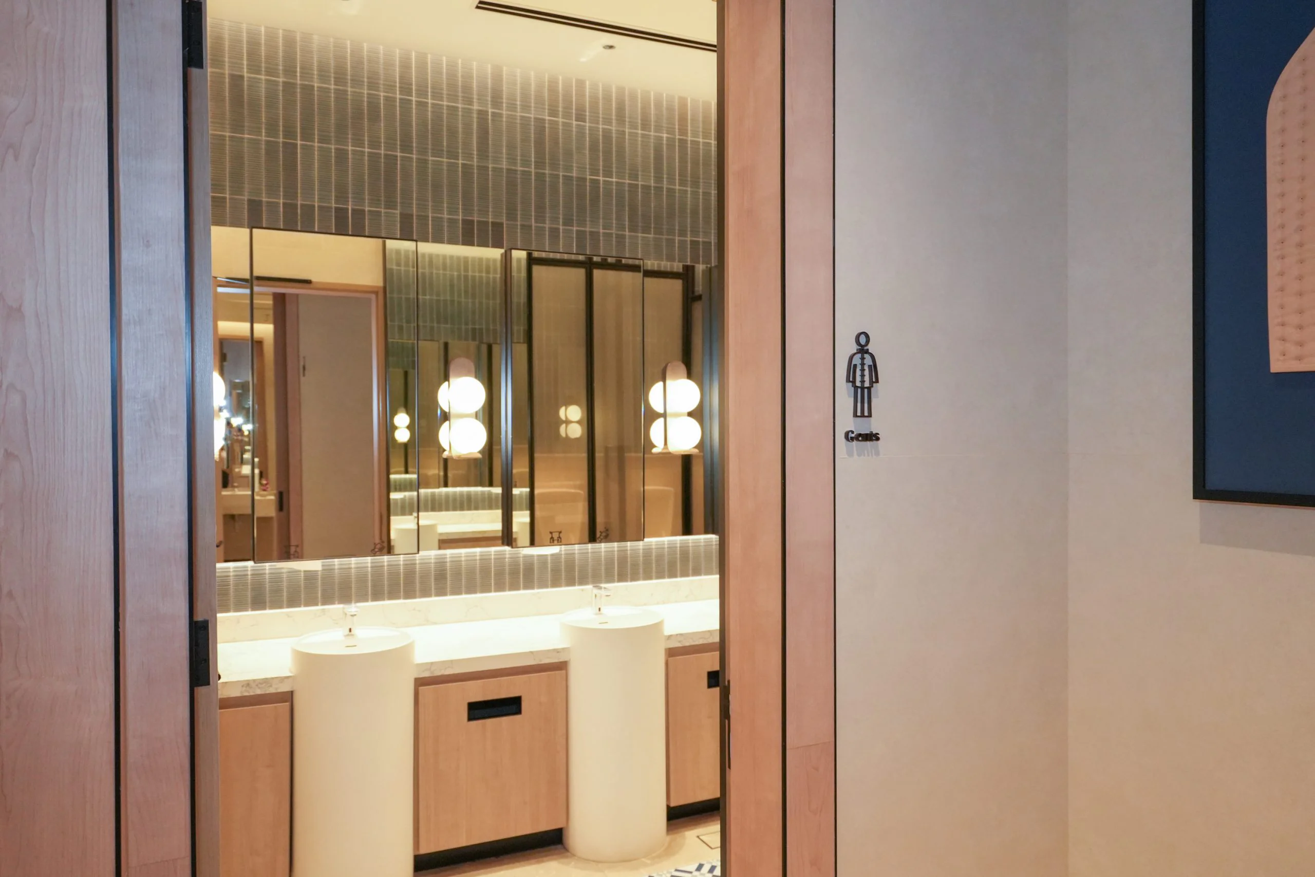The Gents washroom entrance at Iconic Marjorie Penang, opening onto the vanity area.